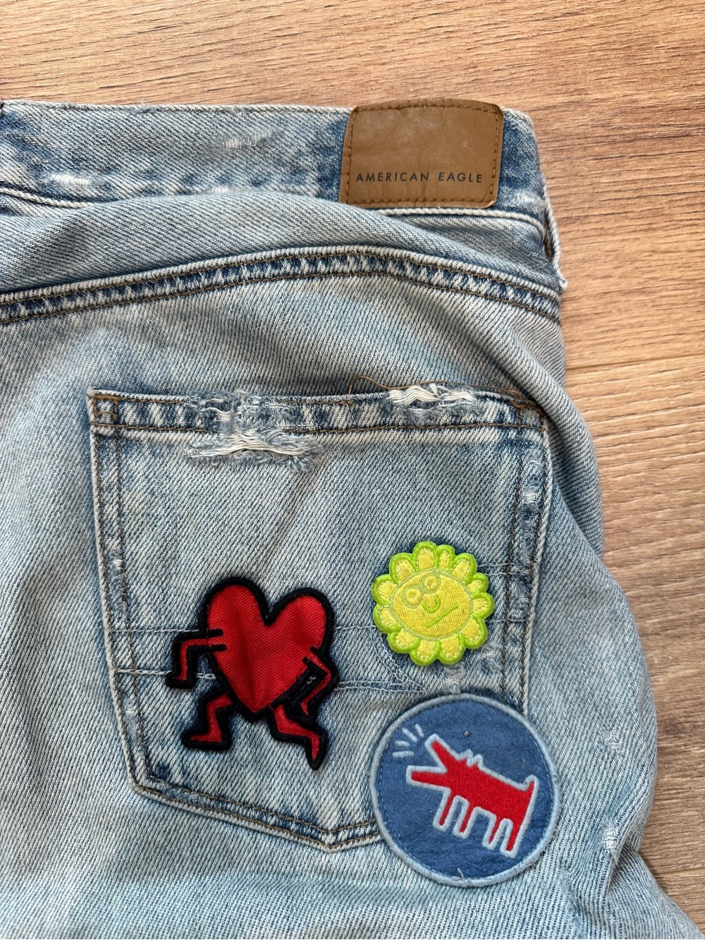 American Eagle x Keith Haring Light Wash Denim Jeans with Patch Details